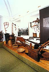 View of ethnography exposition with agricultural equipment of Regional Museum of National History in Český Krumlov 