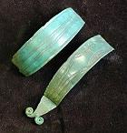 Hořice na Šumavě. Flat bracelets with spiral rose-shaped endings and carved ornaments. The Český Krumlov Local History and Geography Museum. Hořice na Šumavě. Flat bracelets with spiral rose-shaped endings and carved ornaments. The Český Krumlov Local History and Geography Museum.